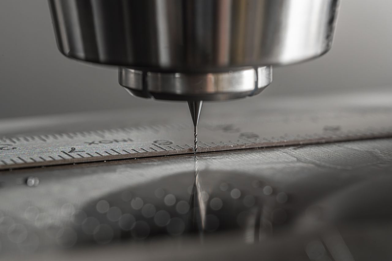 The Art of Drawing Readers In: Your attractive post title goes here Detailed close-up of a CNC milling machine working on metal, showcasing precision and industry technology.